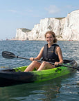 Woman paddling Cambridge Kayaks Neptune single sit on top kayak in clear sea near white cliffs