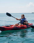 Child paddling Cambridge Kayaks Quest single 1 plus 1 sit on top kayak on flat water