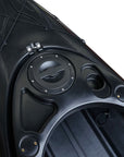 Cockpit view of the Cambridge Kayaks single sit inside leisure fishing kayak in black. Features molded seat area, adjustable footrests, and drain plug.