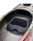Cockpit view of the Cambridge Kayaks touring kayak in jungle camo, showing seat position, foot braces, and easy entry access.