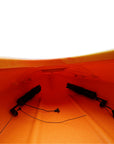 Cockpit view of the Cambridge Kayaks touring kayak in orange camo, showcasing molded seat and waterproof hatch lid.
