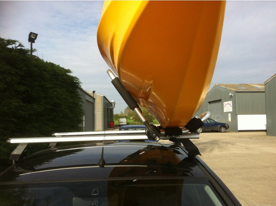 kayak on roof of car fitted to a pair of folding J bars manufactured by cambridge kayaks