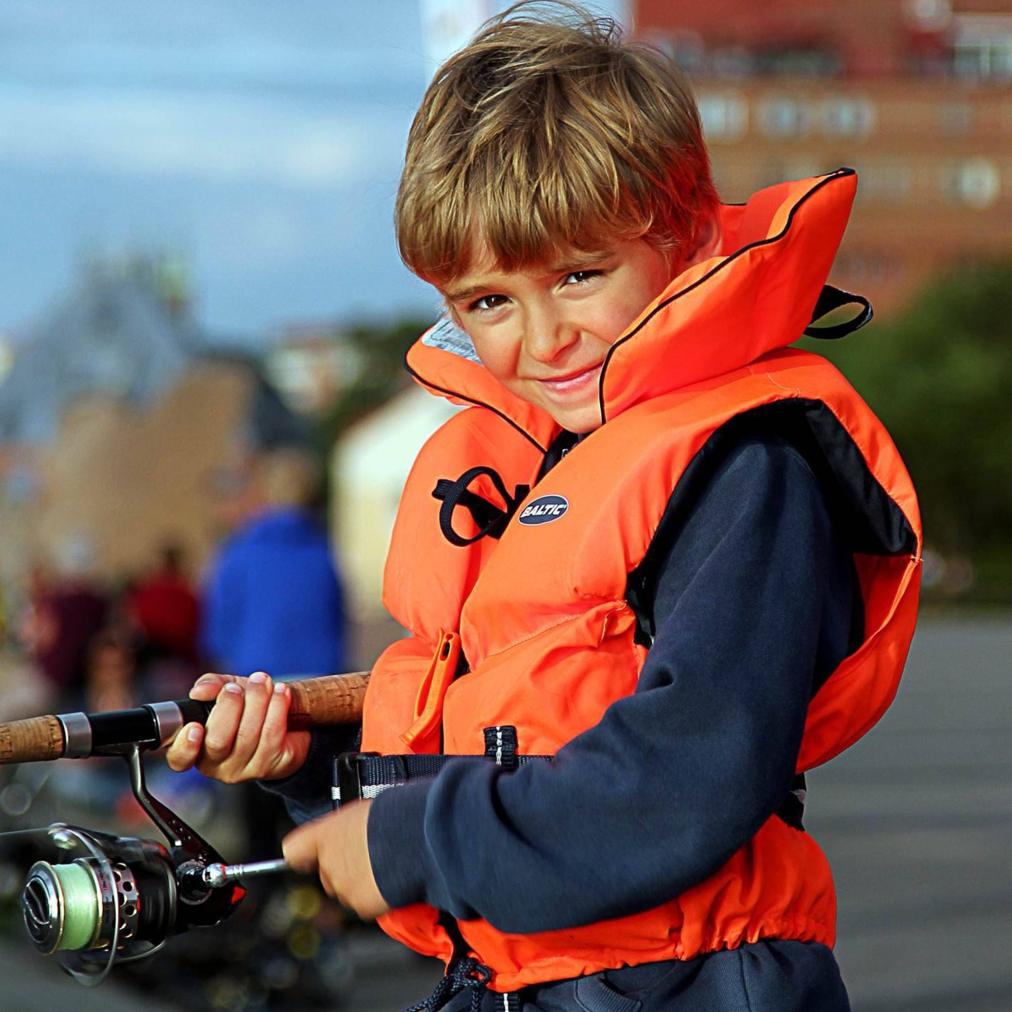 Baltic children’s lifejacket orange front view kids flotation vest for boating and kayaking