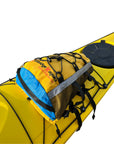 The Cambridge Kayaks Access Deck Bag fitted on the front deck of a kayak, displaying its compact shape, waterproof material, and secure strap positioning for convenient storage.