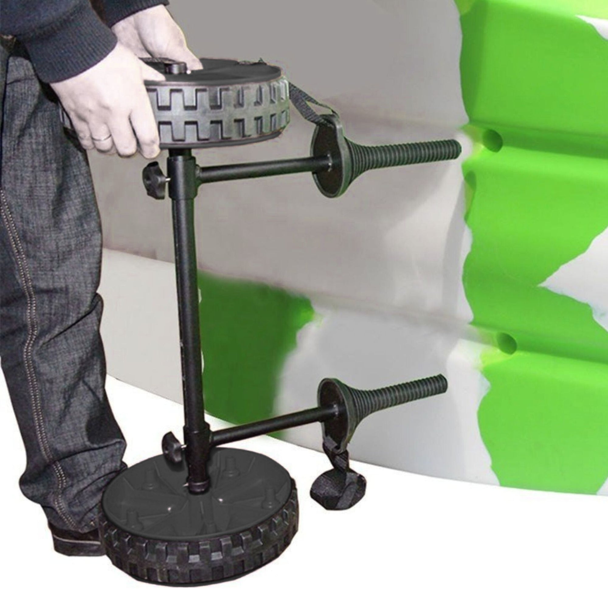 Demonstration image showing the Cambridge Kayaks Adjustable H-Trolley being positioned and adjusted beneath a kayak, highlighting its stable design and adjustable height feature.