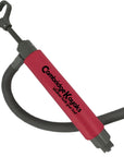 Side view of the Cambridge Kayaks bilge pump showing red cylinder body, grey handle, and detachable hose connection.