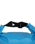 Close-up of blue Cambridge Kayaks waterproof dry bag roll-top, showing buckle clip, folded waterproof seal, and durable welded seams for total gear protection on the water.