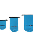 Three blue Cambridge Kayaks waterproof dry bags shown from a side angle, highlighting the flexible PVC build and black top buckles for easy roll-top sealing.