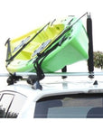 Cambridge Kayaks Roof Bar Centre Post installed and holding a green kayak securely on a vehicle roof, highlighting practical use during transport.