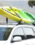Roof-mounted Cambridge Kayaks Centre Post system carrying a yellow kayak, illustrating balance, spacing, and strong tie-down support during travel.