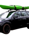 Front view of the Cambridge Kayaks Cradle Support carrying a green kayak on a vehicle roof, highlighting the aerodynamic and stable setup.