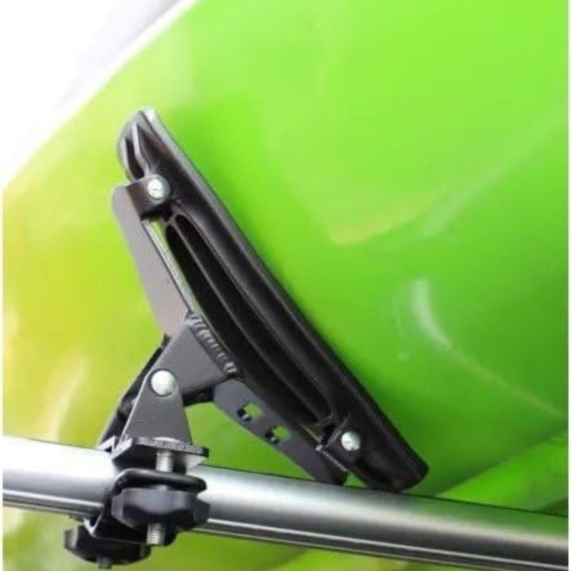 Close-up of the Cambridge Kayaks Cradle Support system showing the kayak resting securely in the padded brackets with tight roof rack straps.