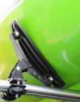 Close-up of the Cambridge Kayaks Cradle Support system showing the kayak resting securely in the padded brackets with tight roof rack straps.