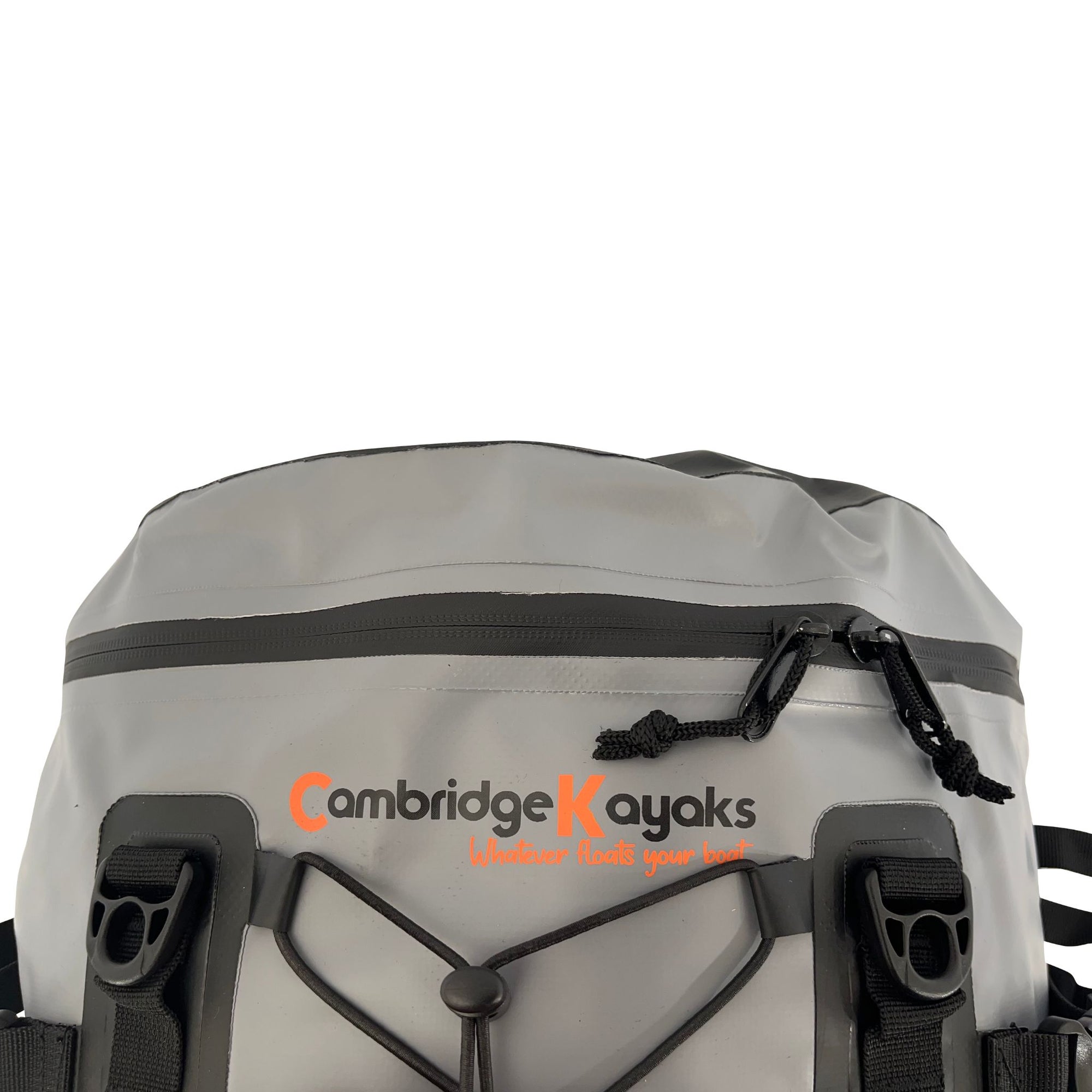 Top angle of the Cambridge Kayaks Deluxe 15L Dry Deck Bag displaying the logo, roll-top buckle system, and elastic storage cord for convenient on-water gear access.