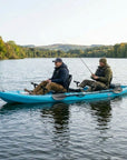 Two men fishing from a Cambridge Kayaks double sit on top kayak on a calm lake