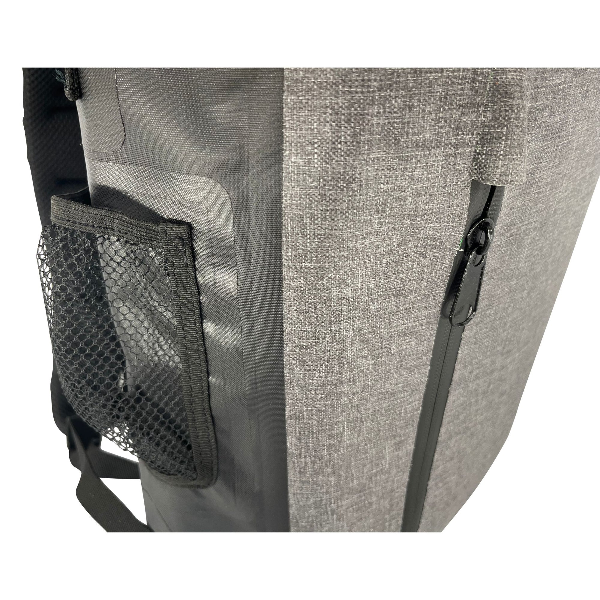 Close-up of the Cambridge Kayaks Dry Bag Backpack side pocket, featuring a mesh bottle holder and reinforced waterproof material for convenient and secure storage.