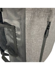 Close-up of the Cambridge Kayaks Dry Bag Backpack side pocket, featuring a mesh bottle holder and reinforced waterproof material for convenient and secure storage.