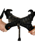Hands demonstrating the setup process of the Cambridge Kayaks Heavy Duty Kayak Trolley, assembling the central frame and kickstand for stability during loading.