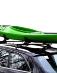 Side view of the Cambridge Kayaks Cradle Support with a green kayak mounted on a car roof, showing secure fit and angled cradle alignment.