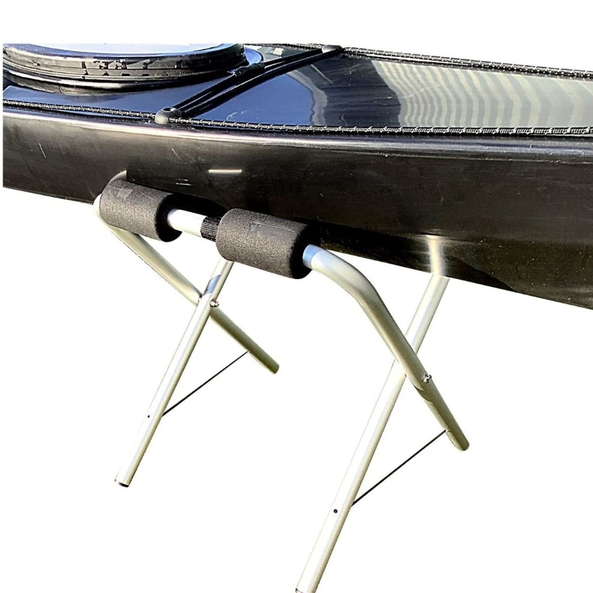 Close up of Cambridge Kayaks folding kayak stand with foam padding protecting hull on aluminium frame