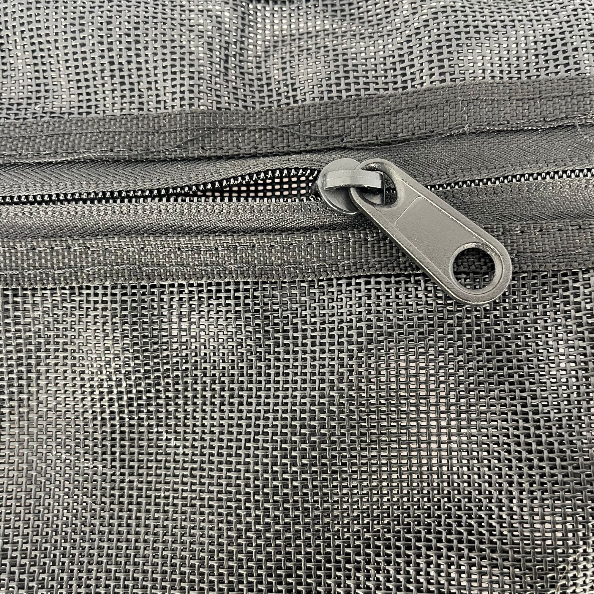 Detailed view of the Cambridge Kayaks lightweight mesh deck bag zipper, highlighting the strong pull tab and reinforced stitching for durability and waterproof resistance.