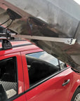 Cambridge Kayaks Load Assisting Rack Bar shown mid-use, demonstrating how it supports kayak lifting at an angle for safe placement onto the roof rack.
