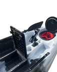 Angled rear view of the Cambridge Kayaks Manta 9ft fishing kayak in black white camo. Highlights hull shape, seat position, and storage for rods and equipment.