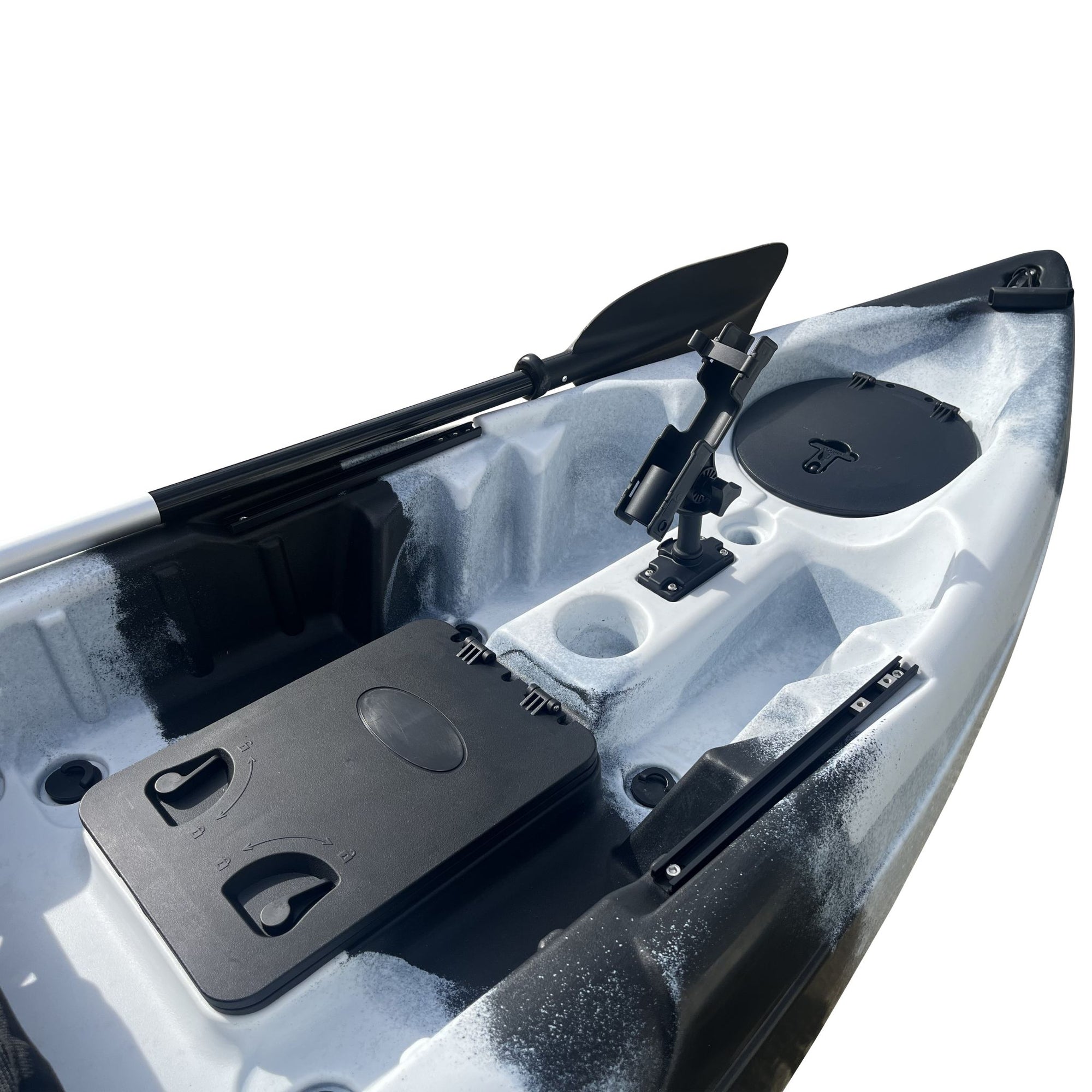Close-up of the Cambridge Kayaks Manta 9ft fishing kayak in black white camo showing the cockpit layout. Displays rod holders, hatch, and molded footrests for angler convenience.