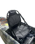 Close-up of the Cambridge Kayaks Manta 9ft fishing kayak in desert camo. Displays front hatch, footrests, and upgraded adjustable seat for fishing comfort.