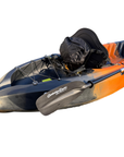 Close-up of the Cambridge Kayaks Neptune single sit-on-top kayak in striking orange and black camo, showing the rear bungee storage area, padded backrest seat, and paddle with logo detailing, ideal for day trips and coastal paddling.