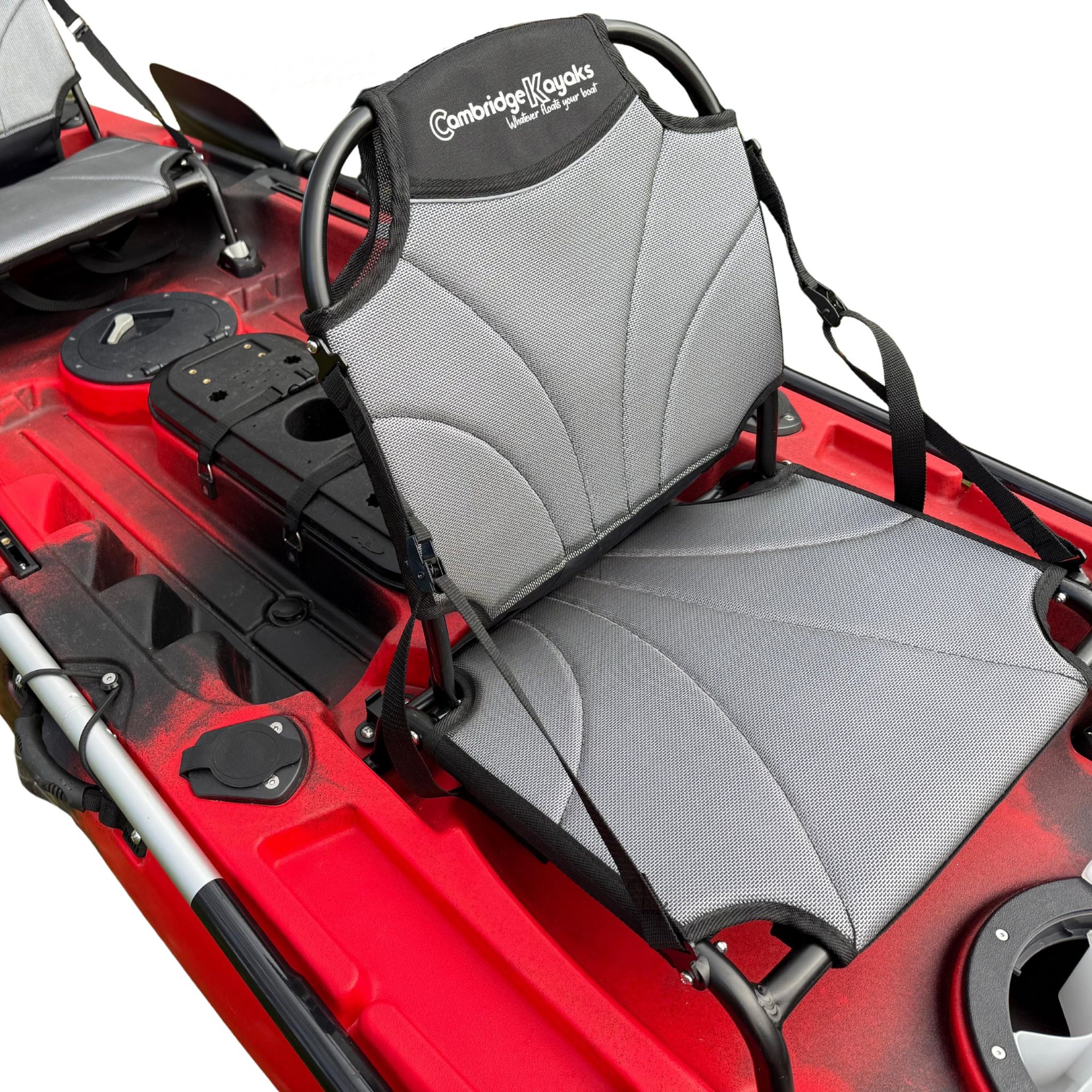 Red Cambridge Kayaks Orca double fishing kayak viewed from the side, showing both seats and paddle mounts.