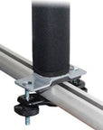 Close-up of a metal rod with a black cylindrical component and mounting hardware on a white background.