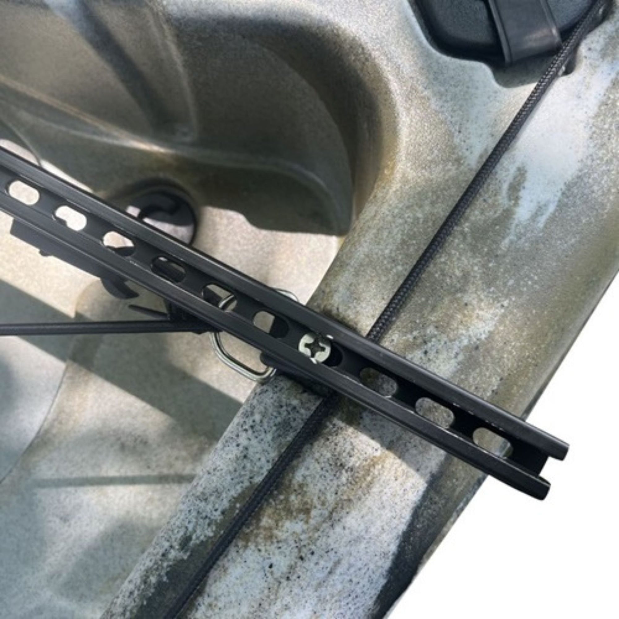 Close-up view of the mounting bracket for the Cambridge Kayaks side floats, attached securely to a kayak rail.