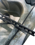 Close-up view of the mounting bracket for the Cambridge Kayaks side floats, attached securely to a kayak rail.