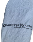 Close-up of the Cambridge Kayaks logo printed on the silver kayak protection cover, highlighting the reinforced material that provides UV and water resistance.
