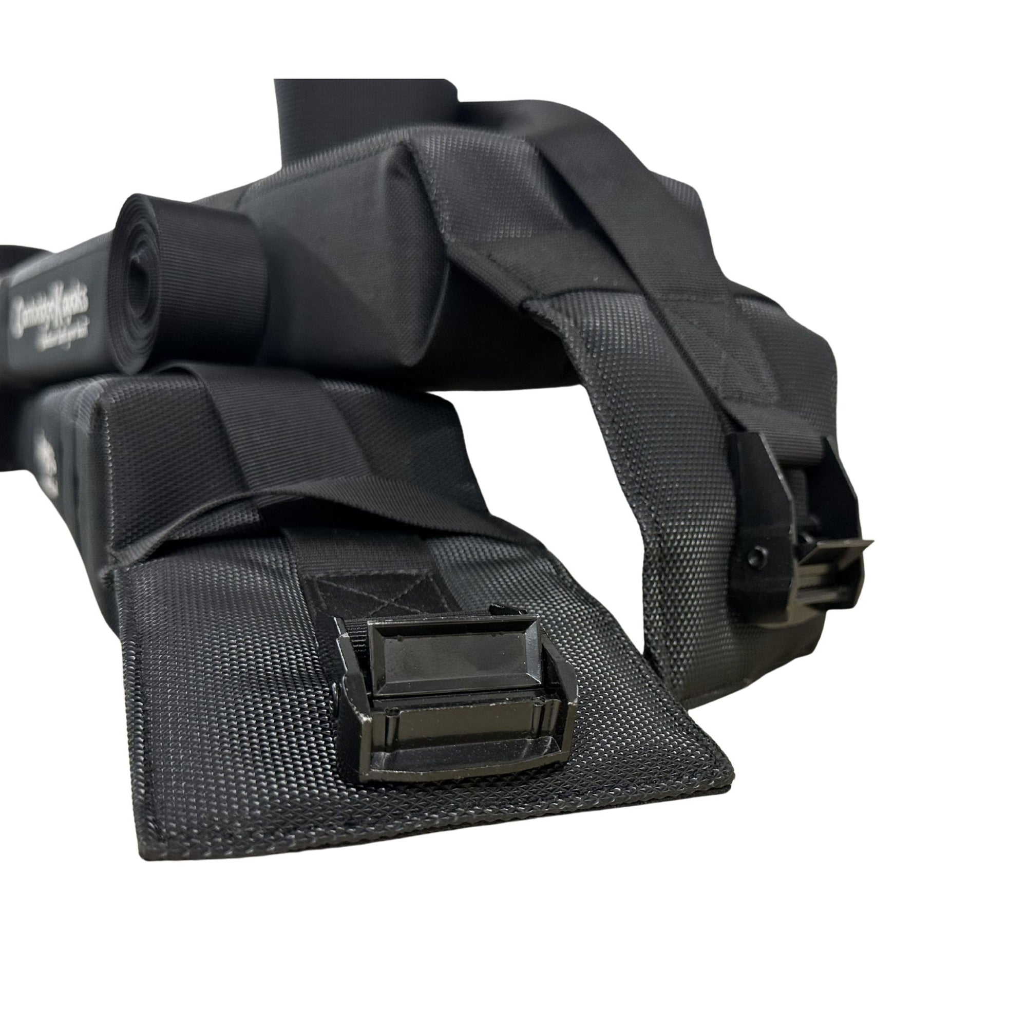 Full Cambridge Kayaks soft roof rack set including straps, buckles, and padding folded neatly together.