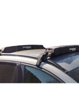 Cambridge Kayaks Soft Roof Rack fitted securely to a vehicle roof, shown from the side to display the cushioned pads and adjustable straps in place. Ideal for carrying kayaks, surfboards, or SUPs safely.