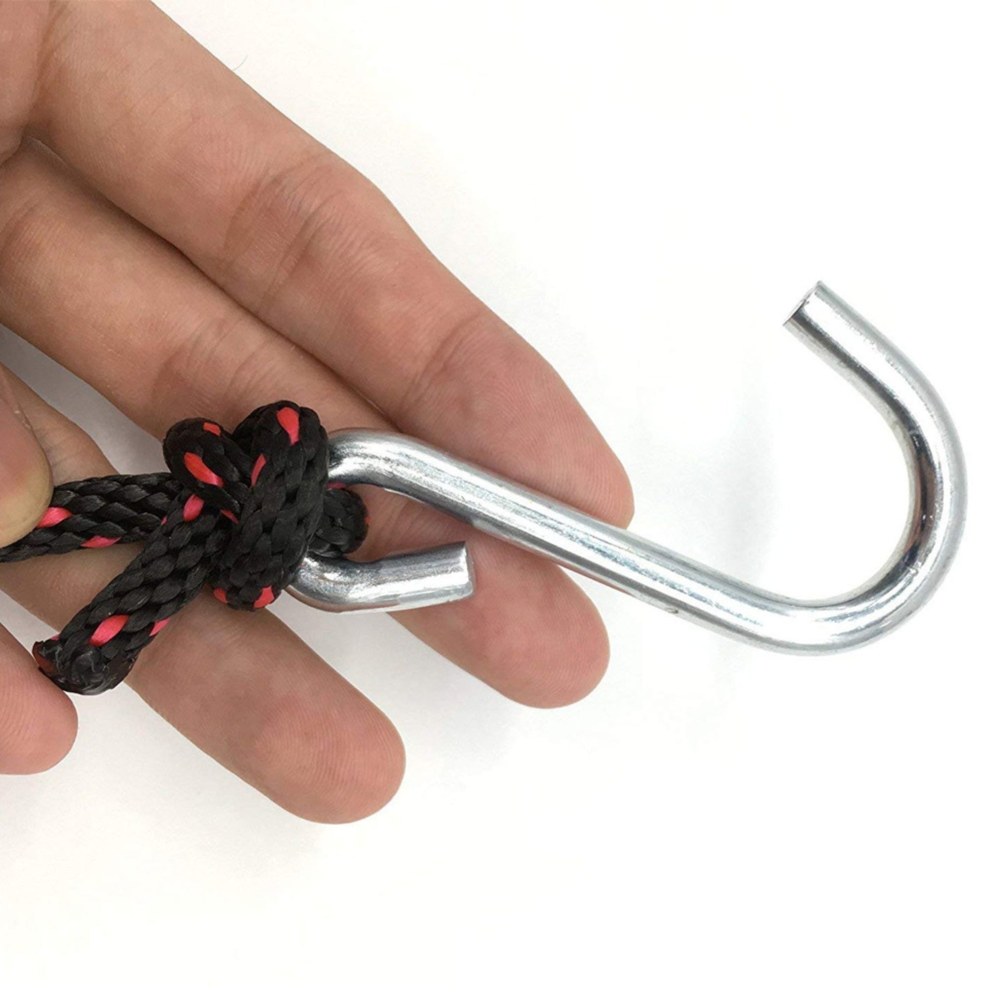 Detail view of a person holding the Cambridge Kayaks tie down hook, highlighting the strong grip and secure attachment point for vehicle or kayak fitting.