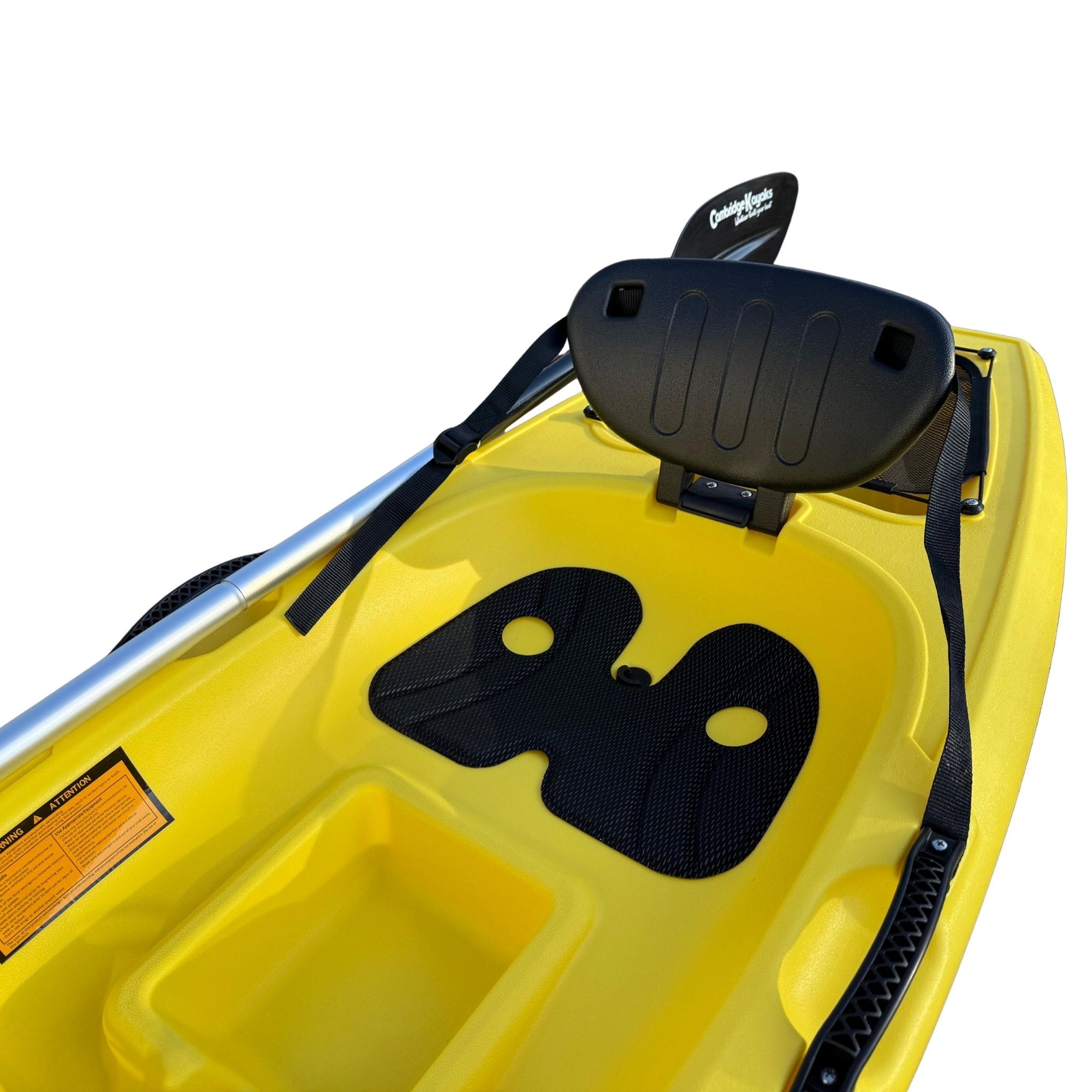 Detailed view of the Cambridge Kayaks Trekker junior kayak seat showing the ergonomic padded backrest, textured footwells for grip, and central storage compartment, designed for comfort and stability.