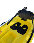 Detailed view of the Cambridge Kayaks Trekker junior kayak seat showing the ergonomic padded backrest, textured footwells for grip, and central storage compartment, designed for comfort and stability.