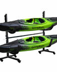Freestanding double kayak storage rack constructed from heavy duty powder coated steel with padded support arms holding two green sit on top kayaks horizontally, designed for garage, indoor storage room, shed, or boat house organization
