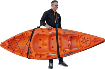 adult carrying a kayak using an adjustable carry strap manufactured by cambridge kayaks