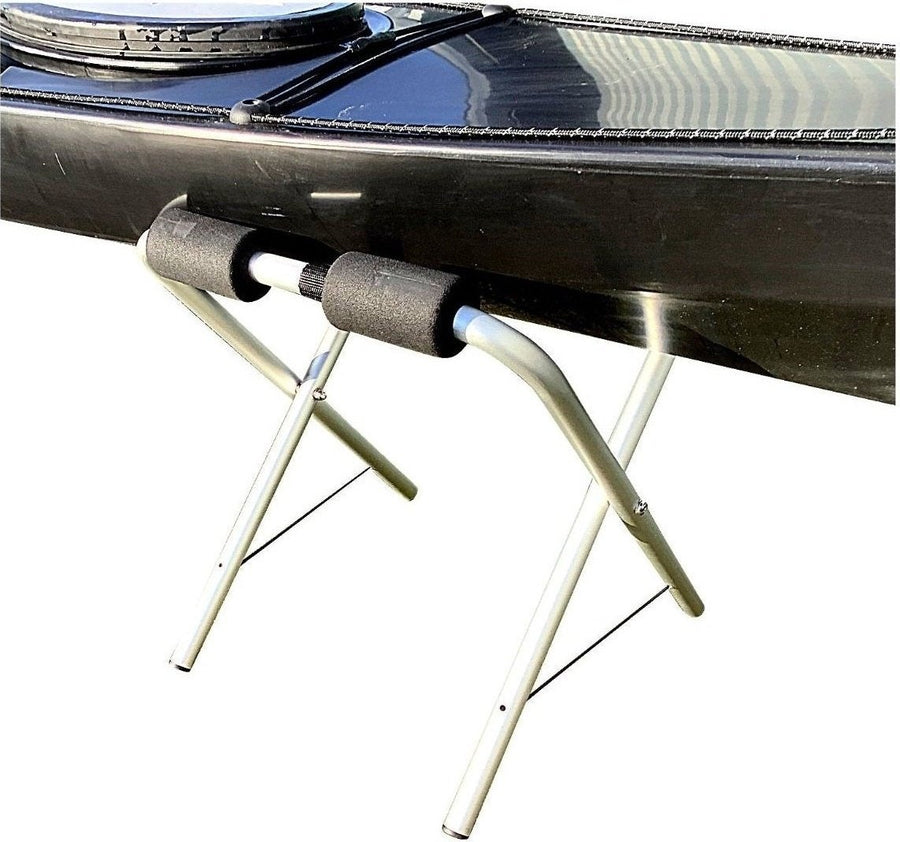 pair of kayak stands with large kayak sitting on top manufactured by cambridge kayaks