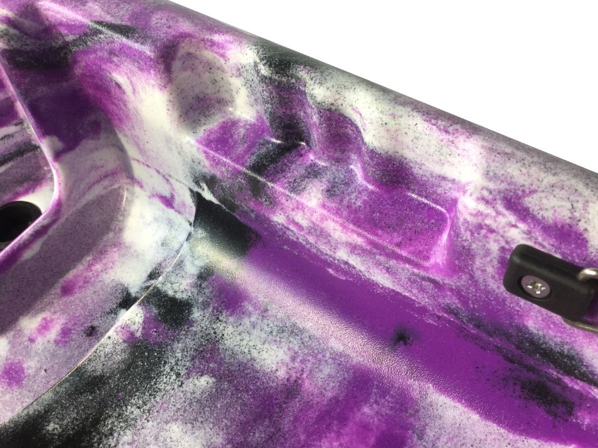 Detail image of Cambridge Kayaks Guppy purple and white kayak deck texture and footwell — showcasing durable high-quality plastic finish.